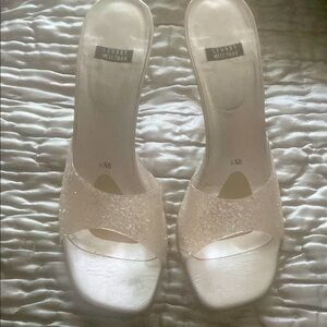 Stuart Weitzman Cream Mules with Leather soles, lucid 4 inch heels.